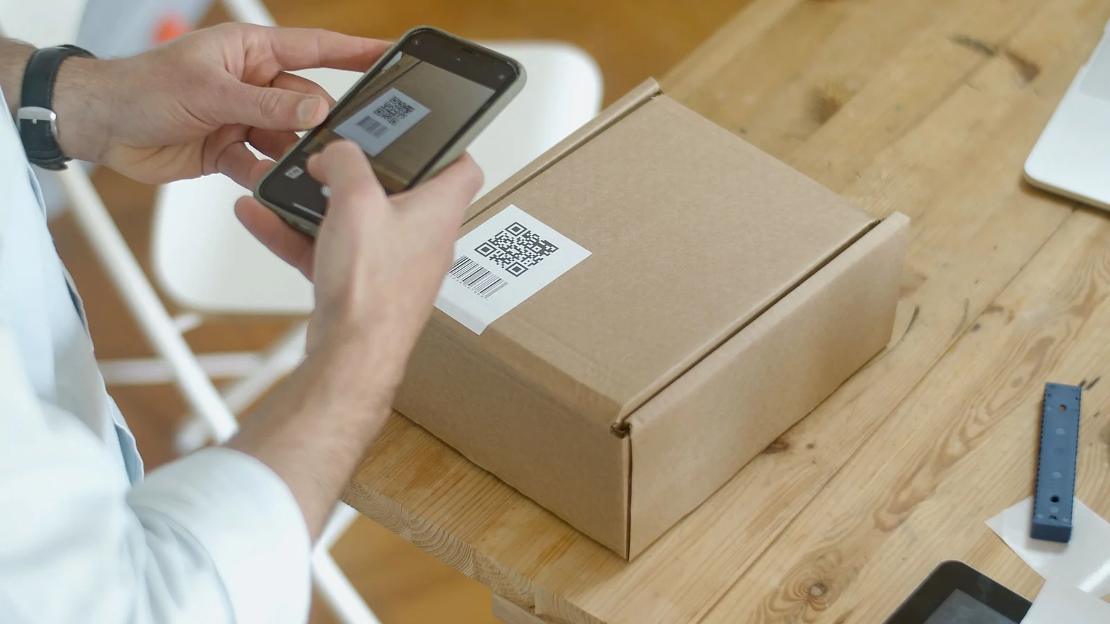 Person scanning a QR code with a smartphone