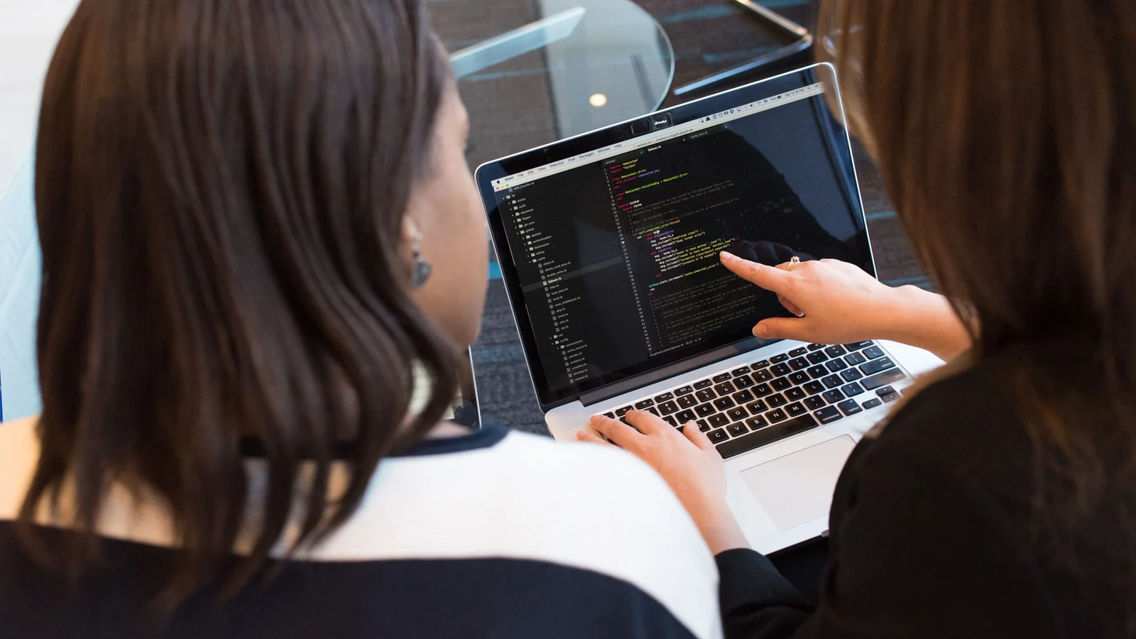 Developers reviewing structured code for JSON validation