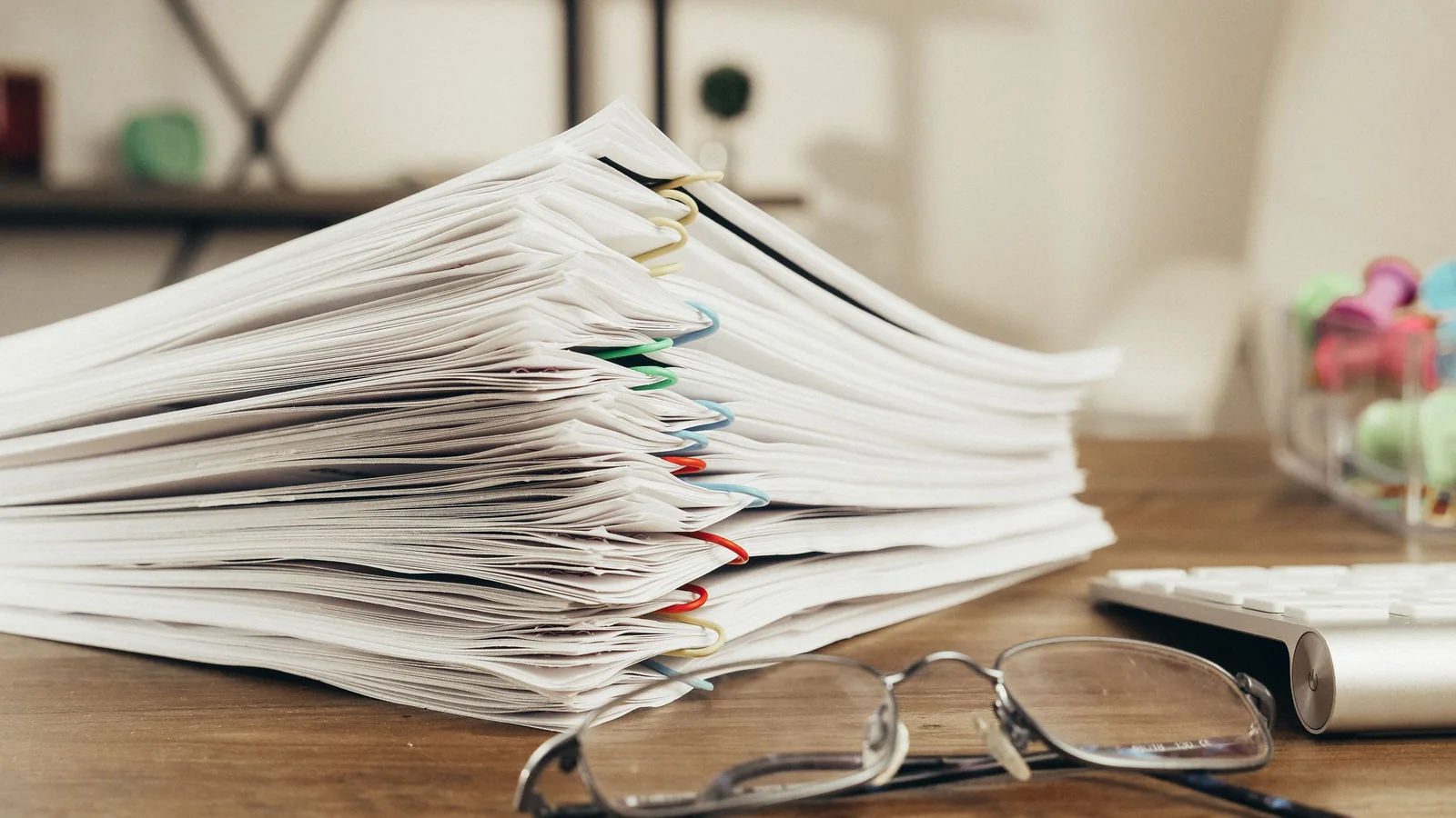 Stack of clipped documents representing a PDF split into page ranges